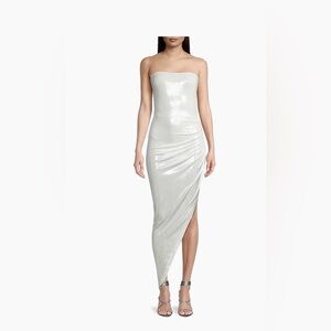 Norma Kamali's

Cut in an asymmetric silhouette, shirred strapless gown new